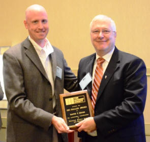 David Biggs accepts the Haller Award from Ben Harris, Chairman of the DPC. 
