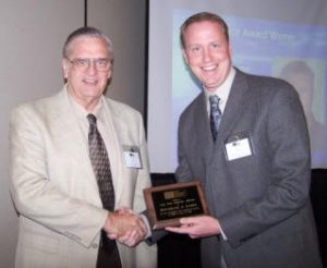 Ben Harris (right) accepts a 2008 Service Award from John Chrysler for his exceptional contributions to TMS behind the scene.