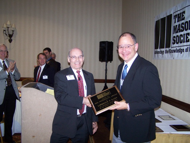 Larry Kahn (right) is congratulated by Dr. Max L. Porter(left) after being presented with the 2006 President's Award.