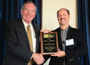 John Tawresey (left) is congratulated by TMS President Scott Walkowicz during the presentation of Tawresey's Honorary Membership at The Masonry Society's 2015 Annual Meeting in Indianaplois, Indiana.
