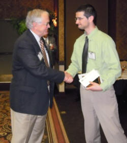 Dr. Russell Brown (left) congratulates Jacob Sherman.