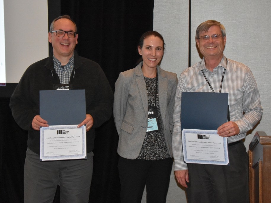 John Hochwalt (left) and Richard Bennett (right) receive a TMS Journal Outstanding General Interest Paper from Laura Redmond, TMS Journal Editor, at the 14th NAMC