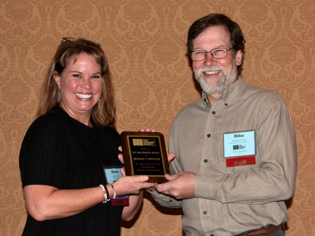 Michael Schuller receives a 2023 TMS Service Award from Dawn Rogers for his support of TMS Staff during the the 2022 Annual Meeting